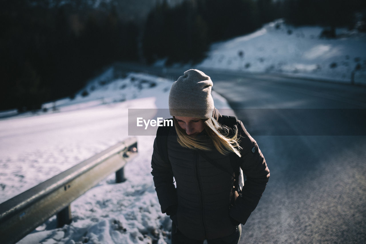 Woman wearing hat in snow