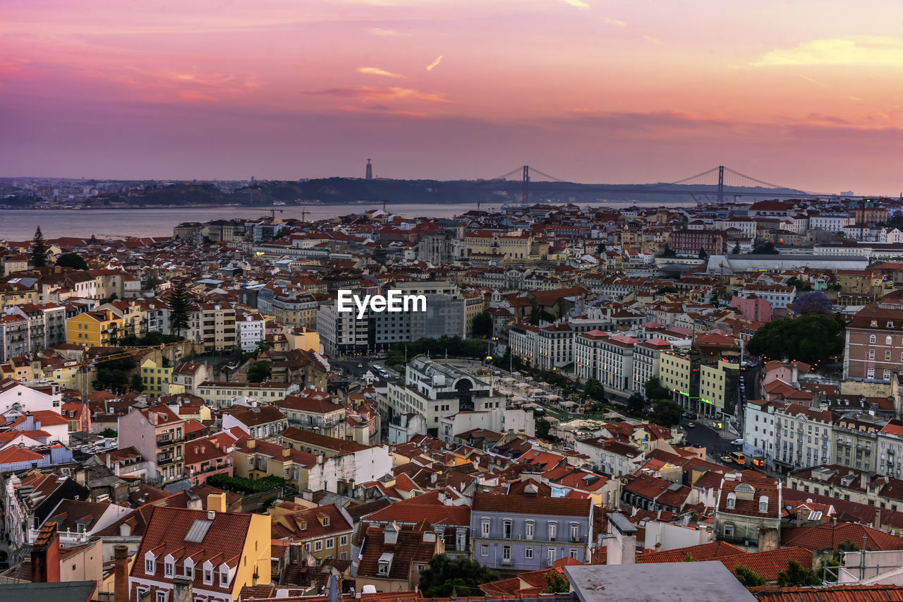 Cityscape against sky during sunset