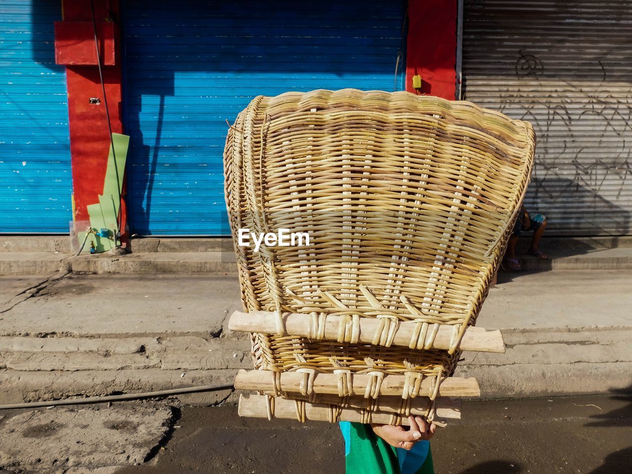 MAN WITH BICYCLE ON BASKET