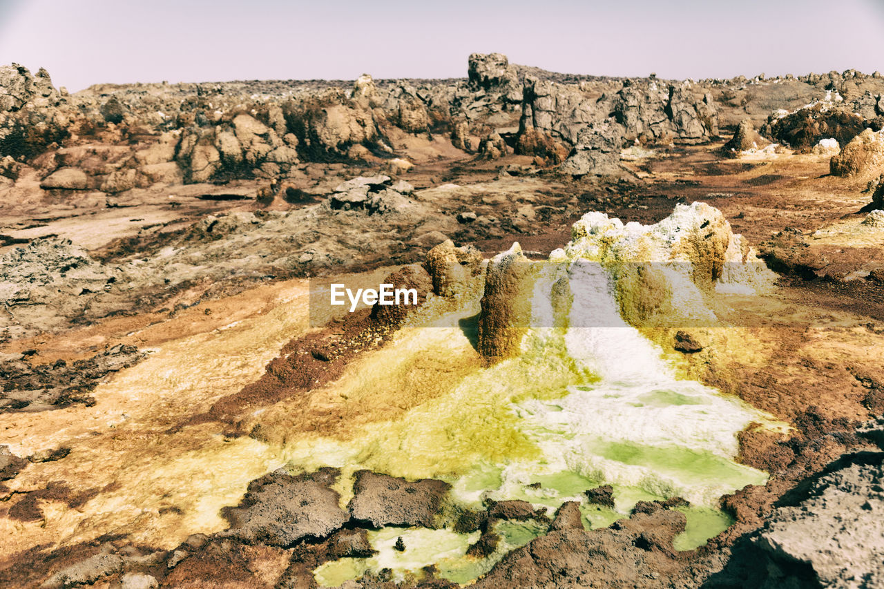 VIEW OF ROCK FORMATIONS IN A VALLEY