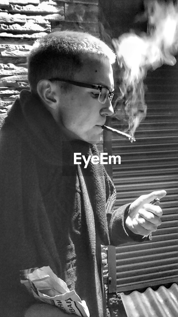 Close-up of man smoking cigarette