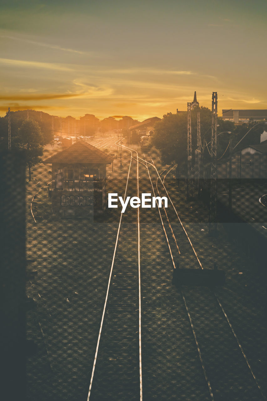 High angle view of railroad tracks against sky during sunset