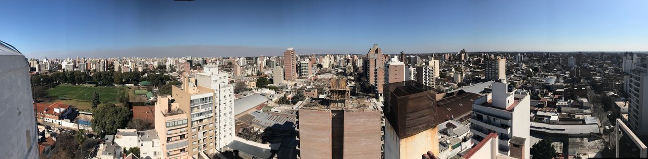 High angle view of city buildings against sky