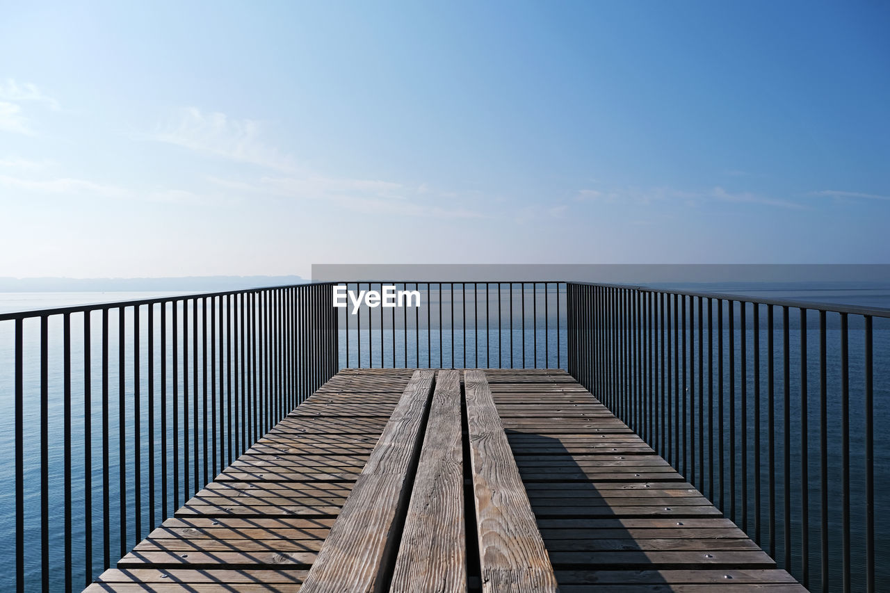 Pier over sea against sky