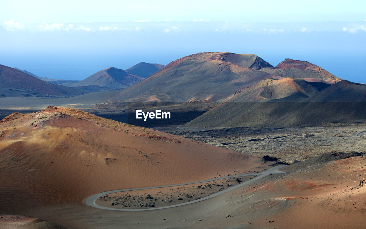 Scenic view of volcanic landscape against sky