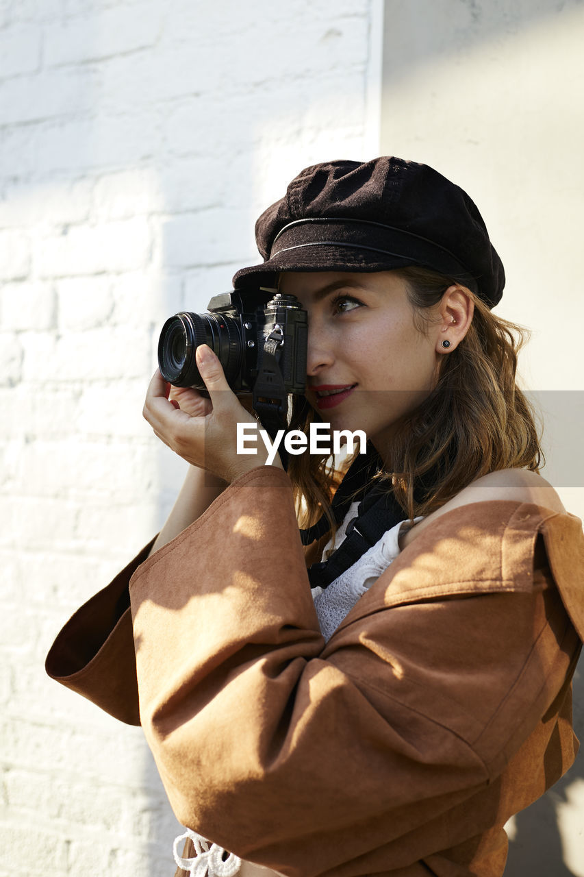 Woman photographing with camera