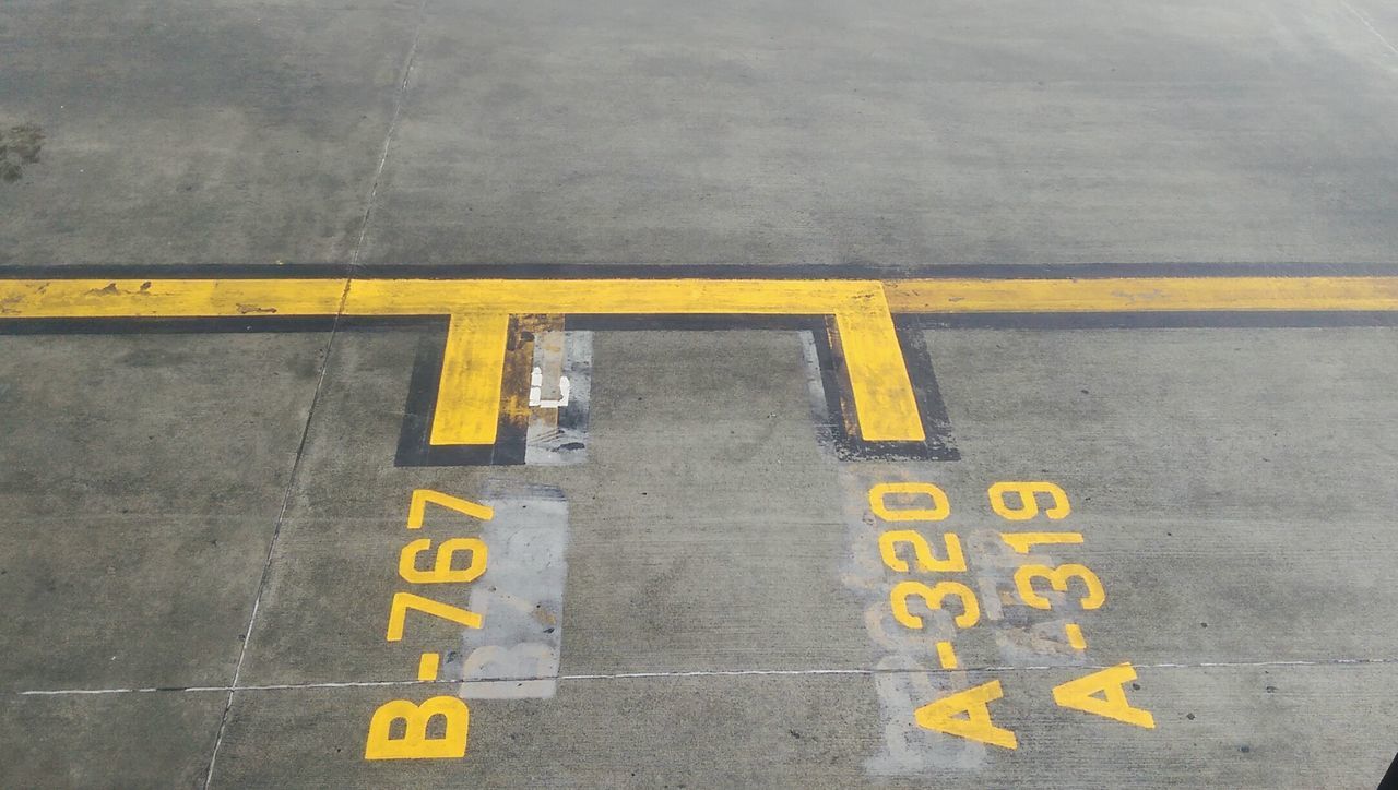 High angle view of markings and numbers on road