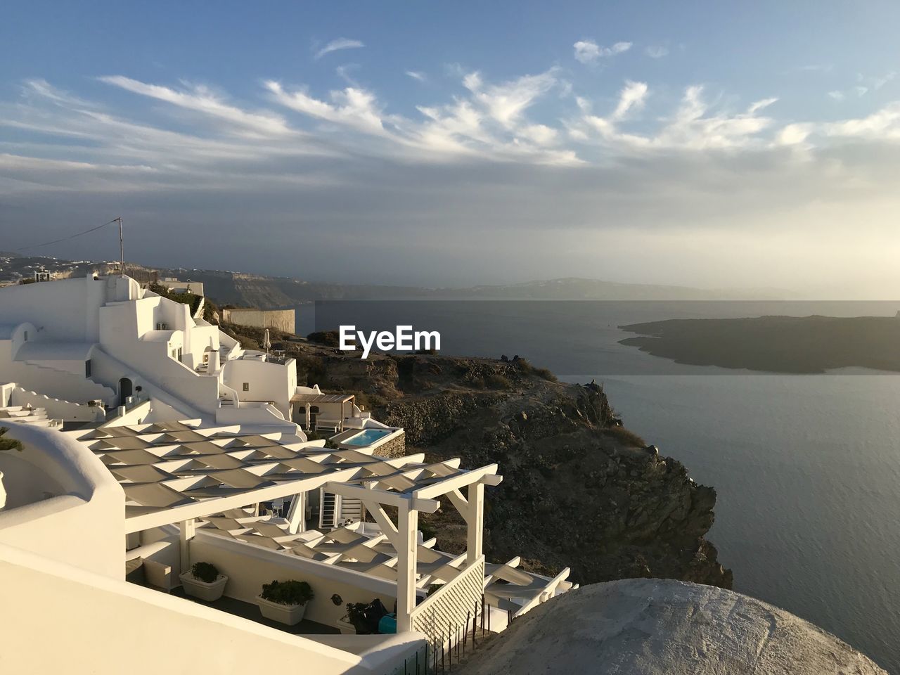 High angle view of buildings against cloudy sky