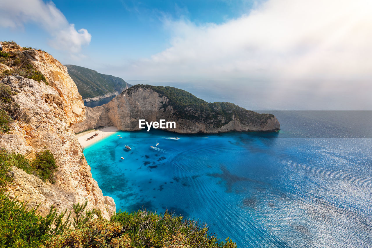 SCENIC VIEW OF SEA AND ROCK FORMATIONS AGAINST SKY