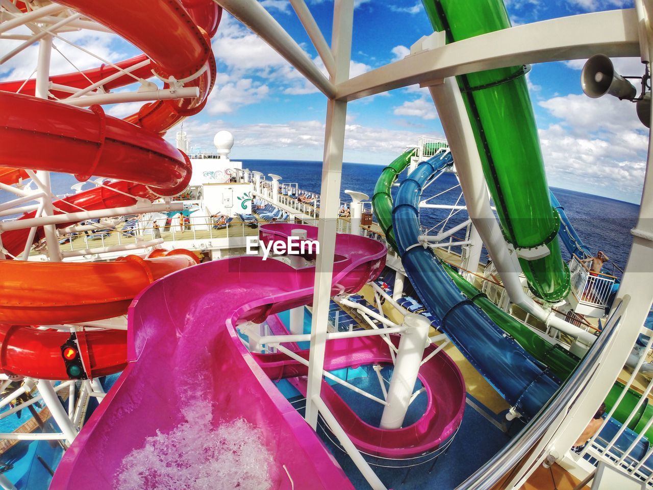 Colorful water slides on cruise ship in sea