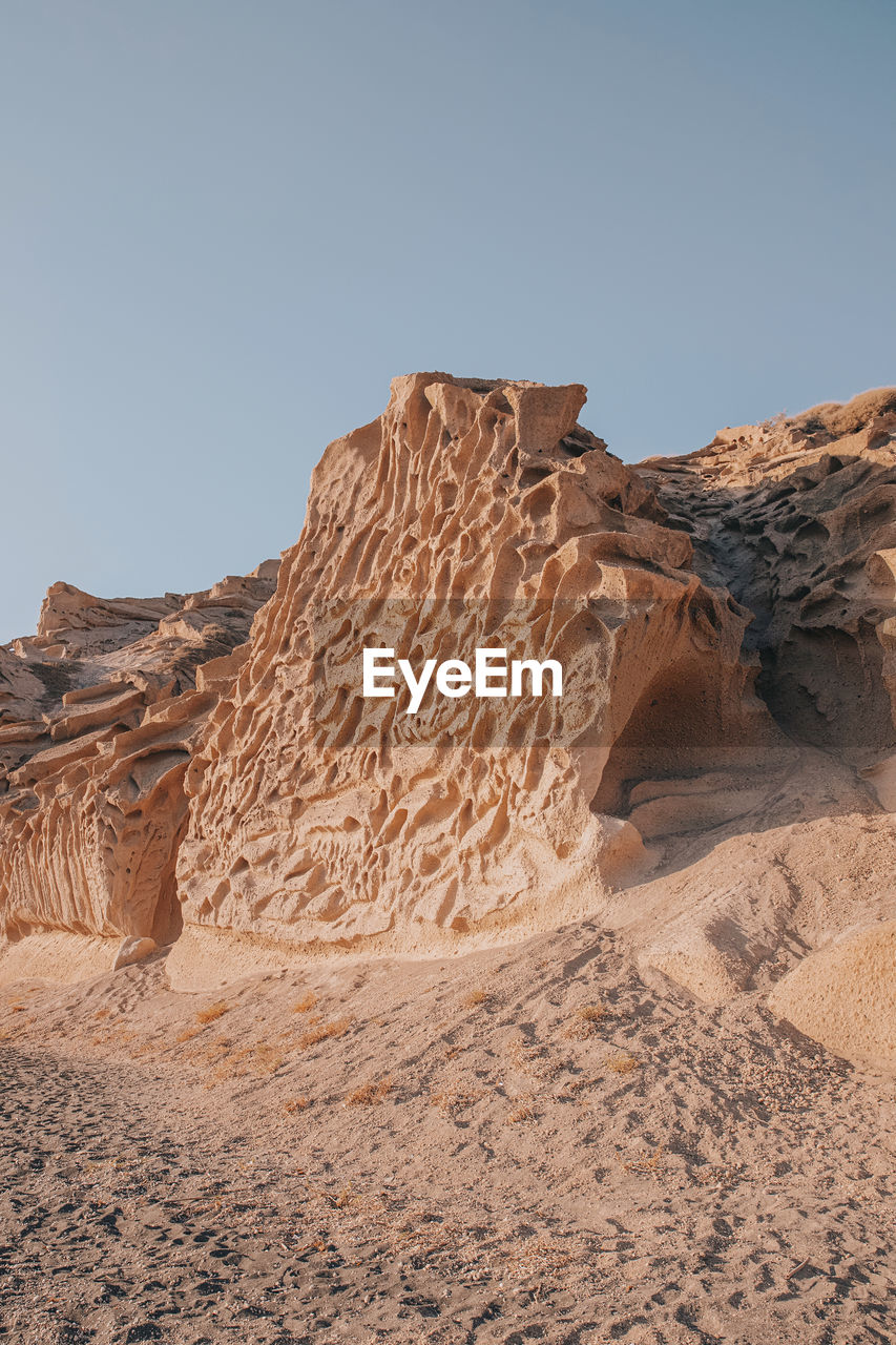 Rock formations in desert against clear sky