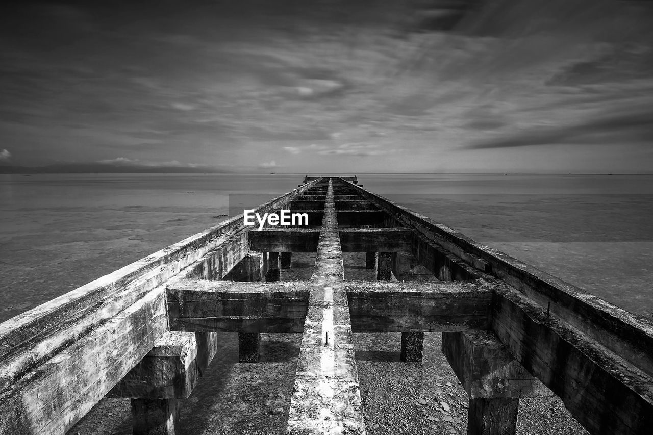 Pier over sea against sky