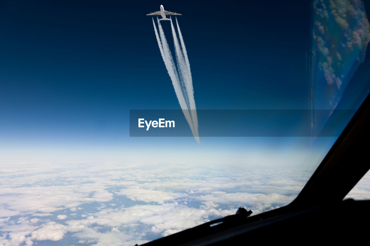 Aerial view of vapor trail in sky