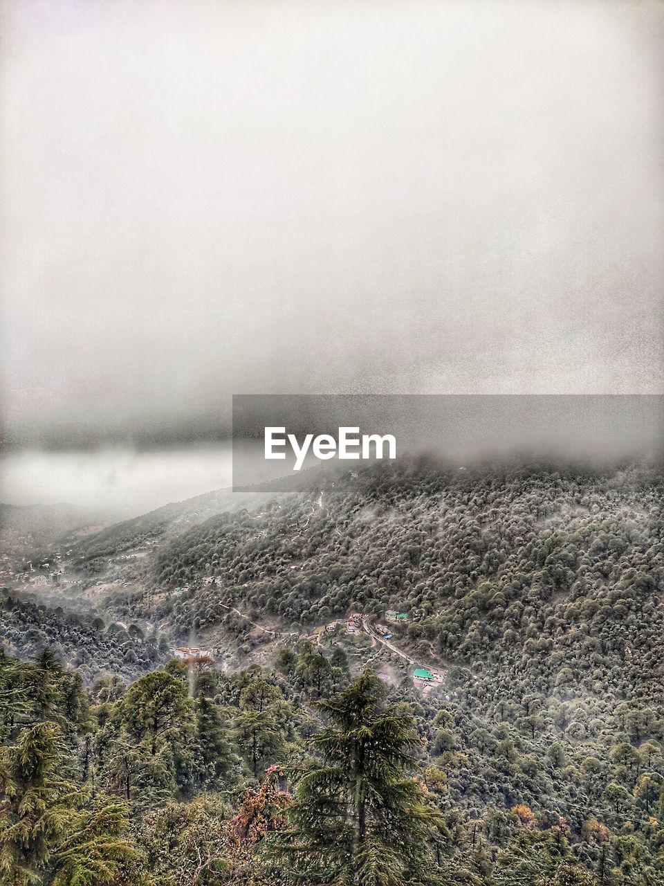 SCENIC VIEW OF FOG OVER LAND