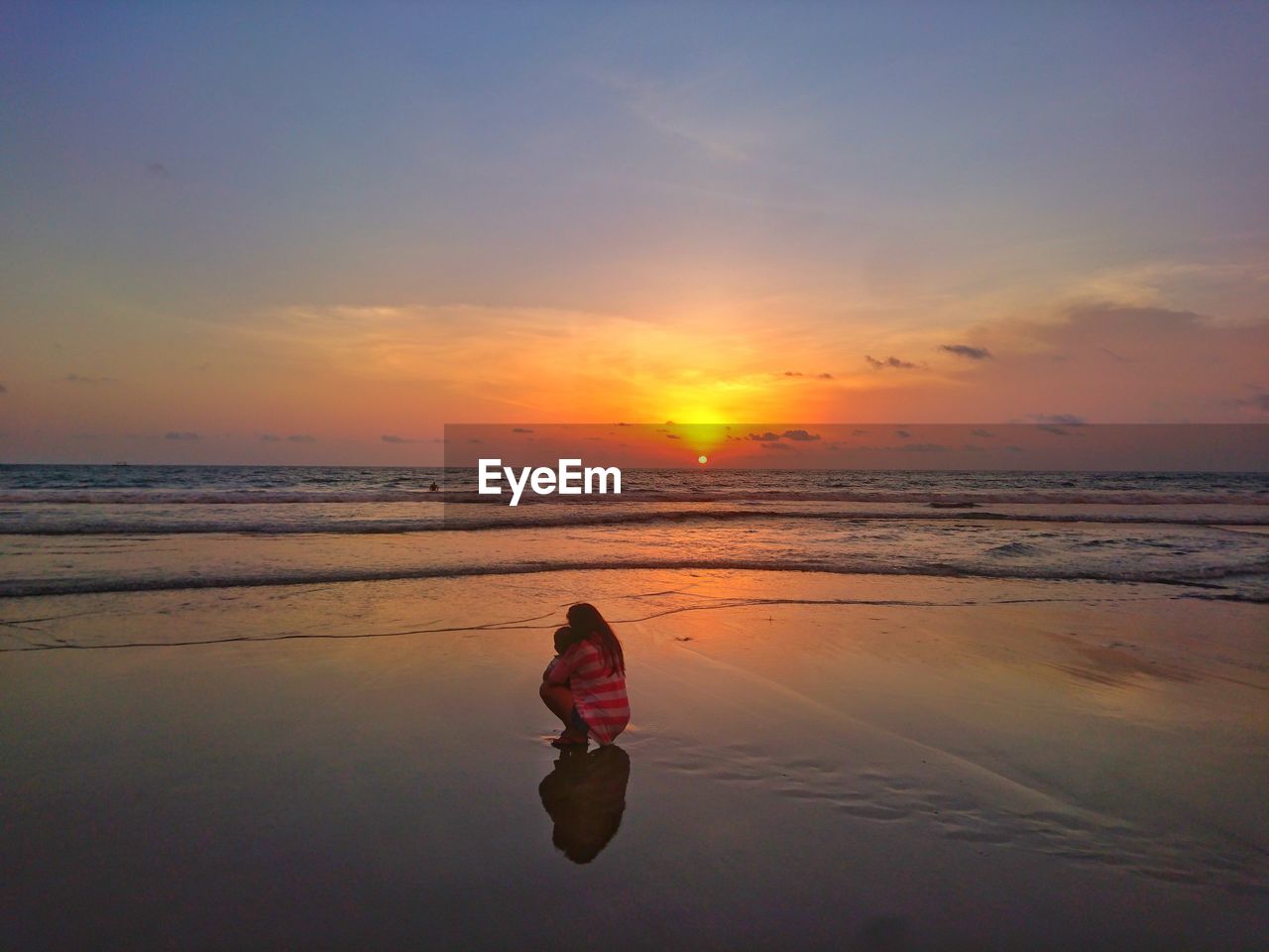 SCENIC VIEW OF BEACH DURING SUNSET