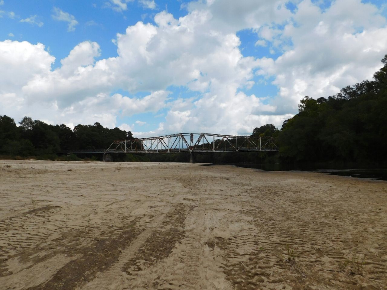 View of bridge against cloudy sky