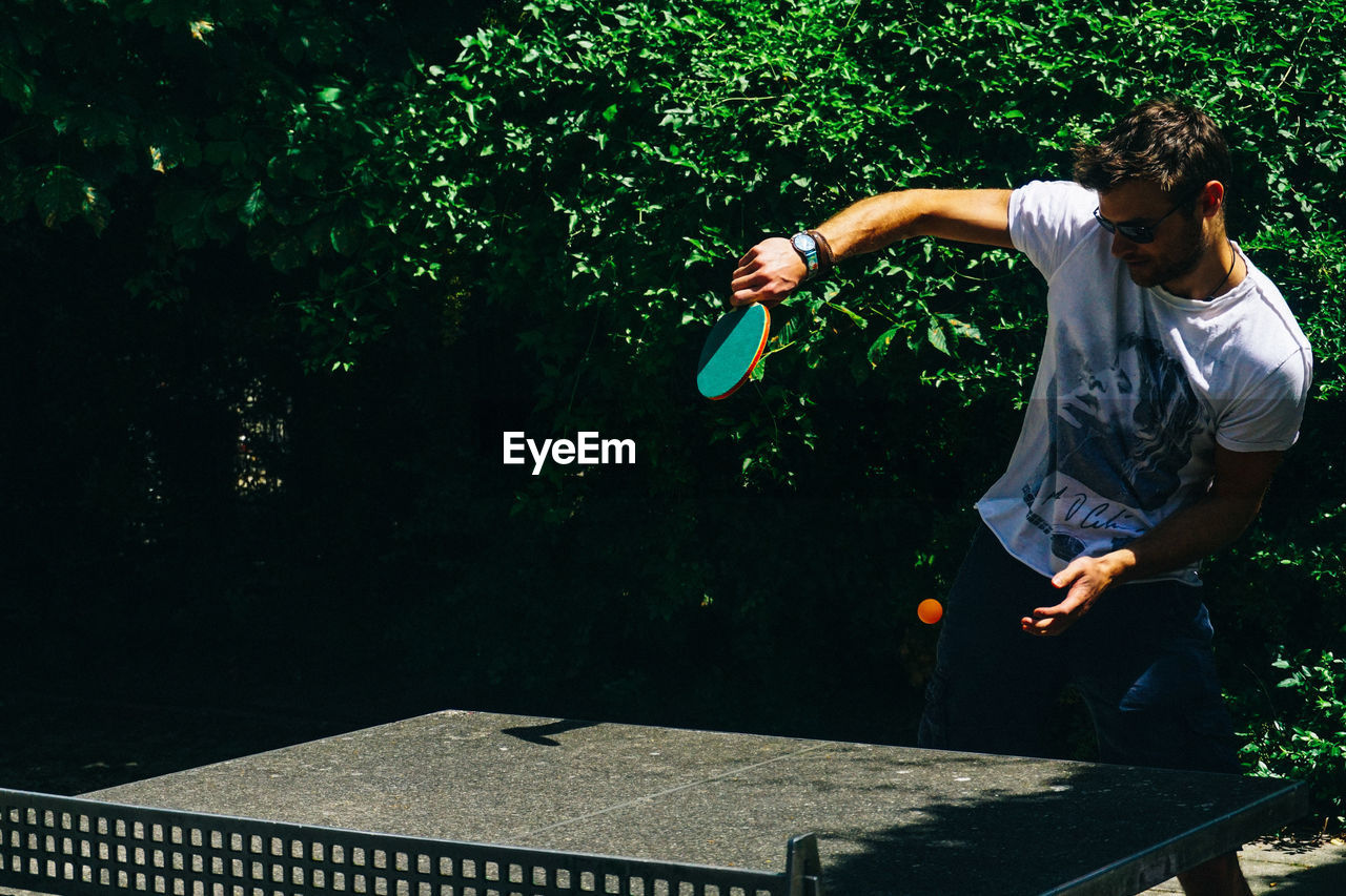 Young man playing table tennis