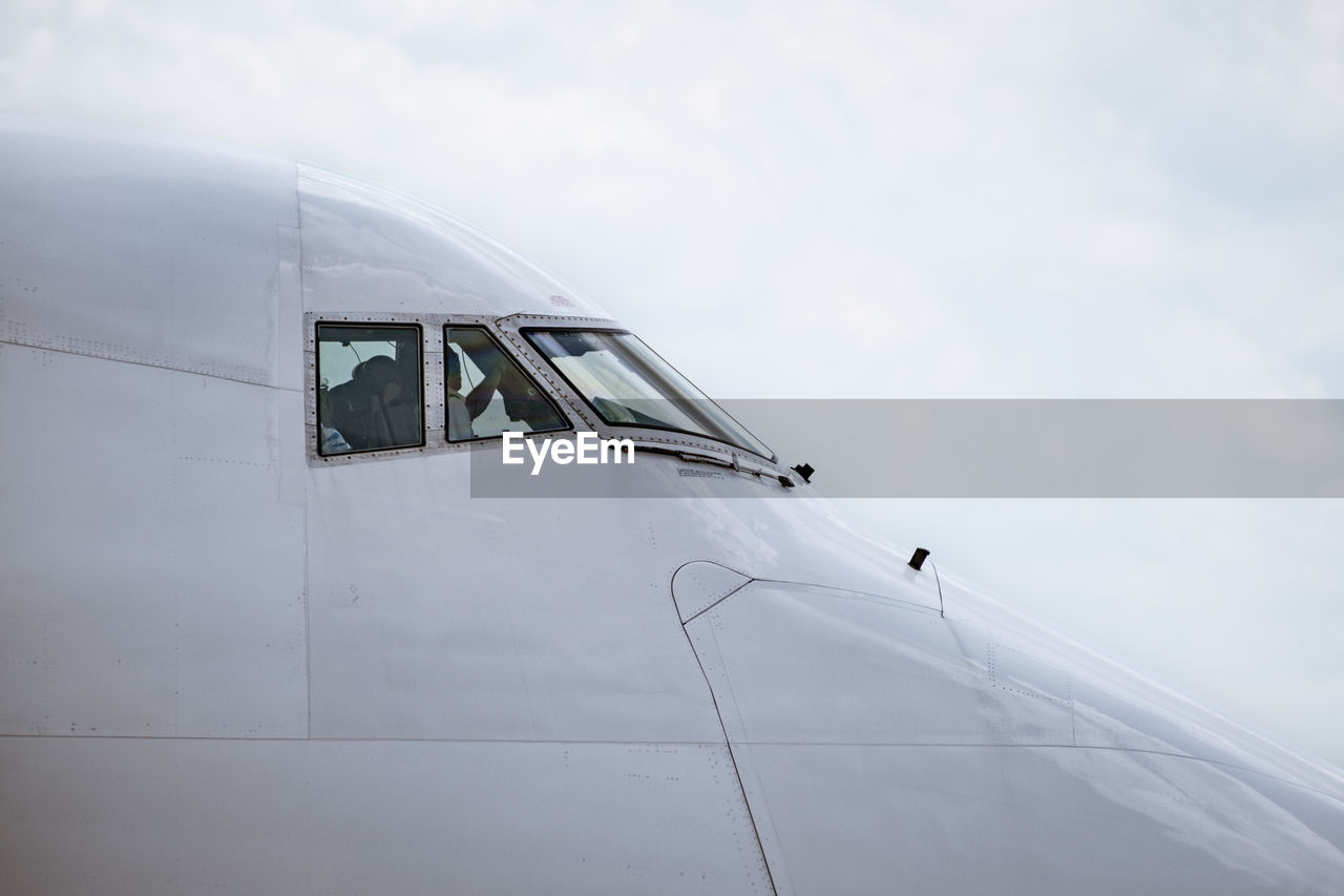 low angle view of airplane flying in sky