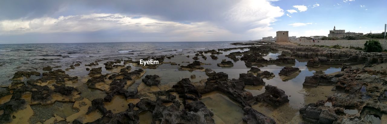 Panoramic view of beach against sky