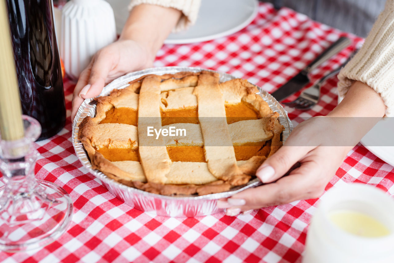 Midsection of woman holding food