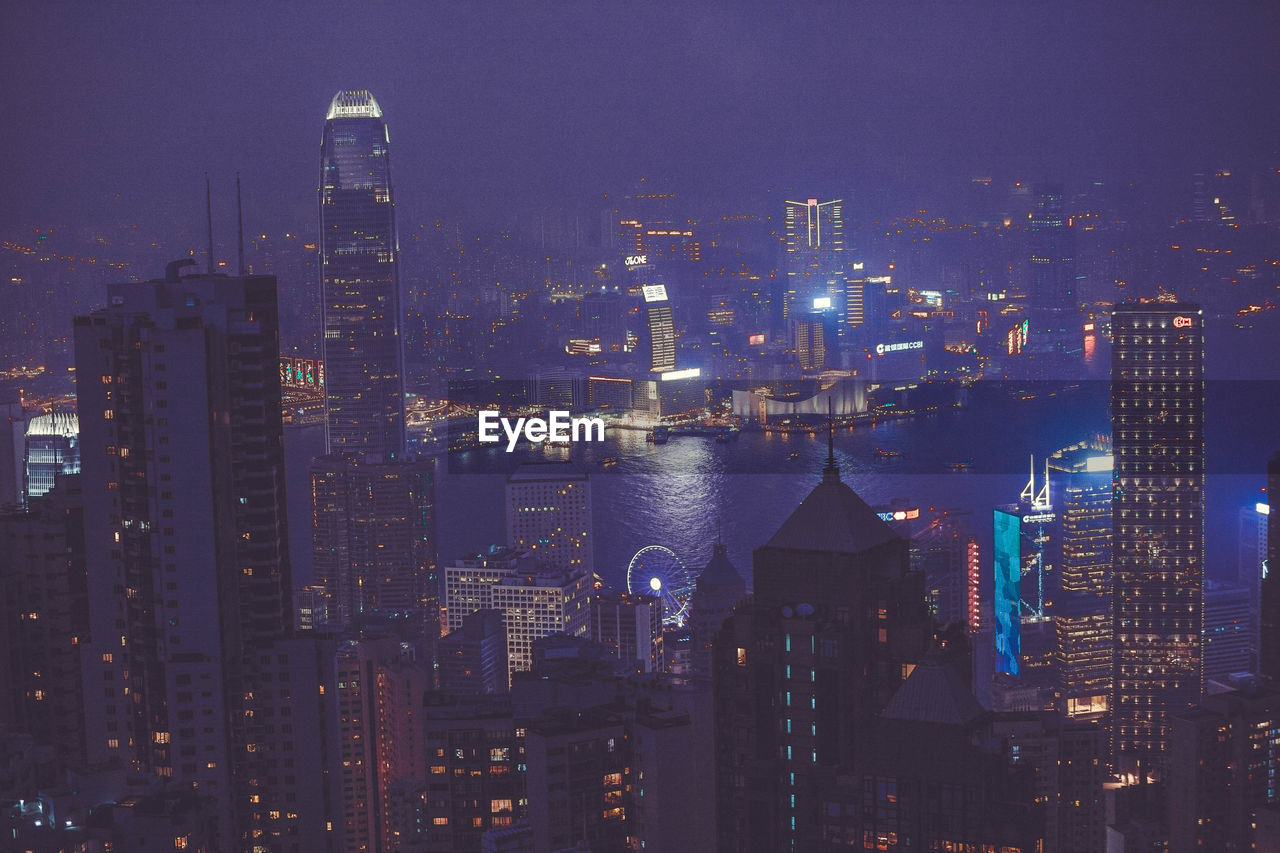 Aerial view of city lit up at night