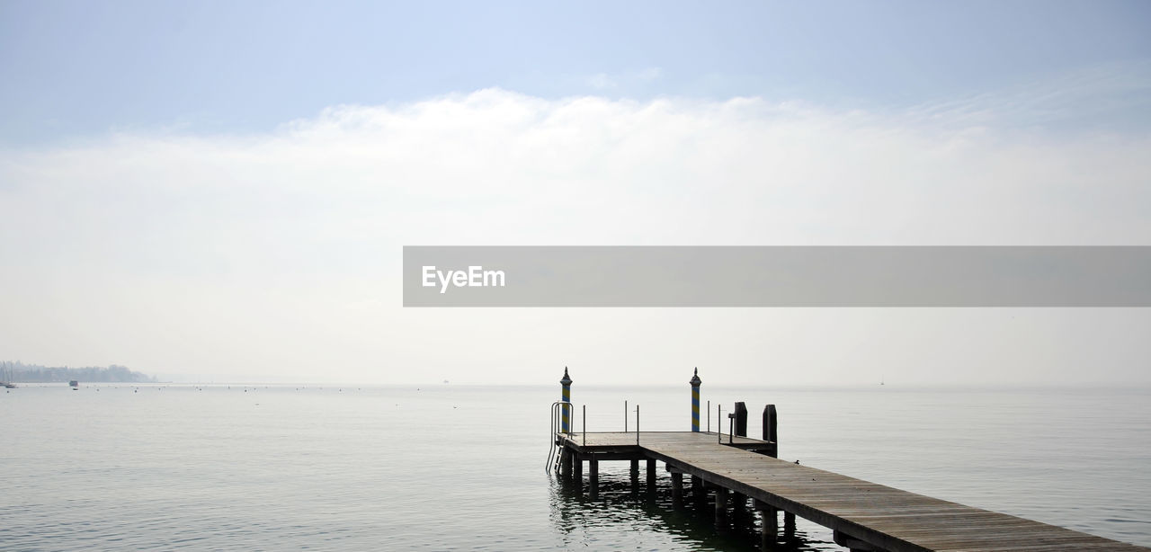 Pier on sea against sky