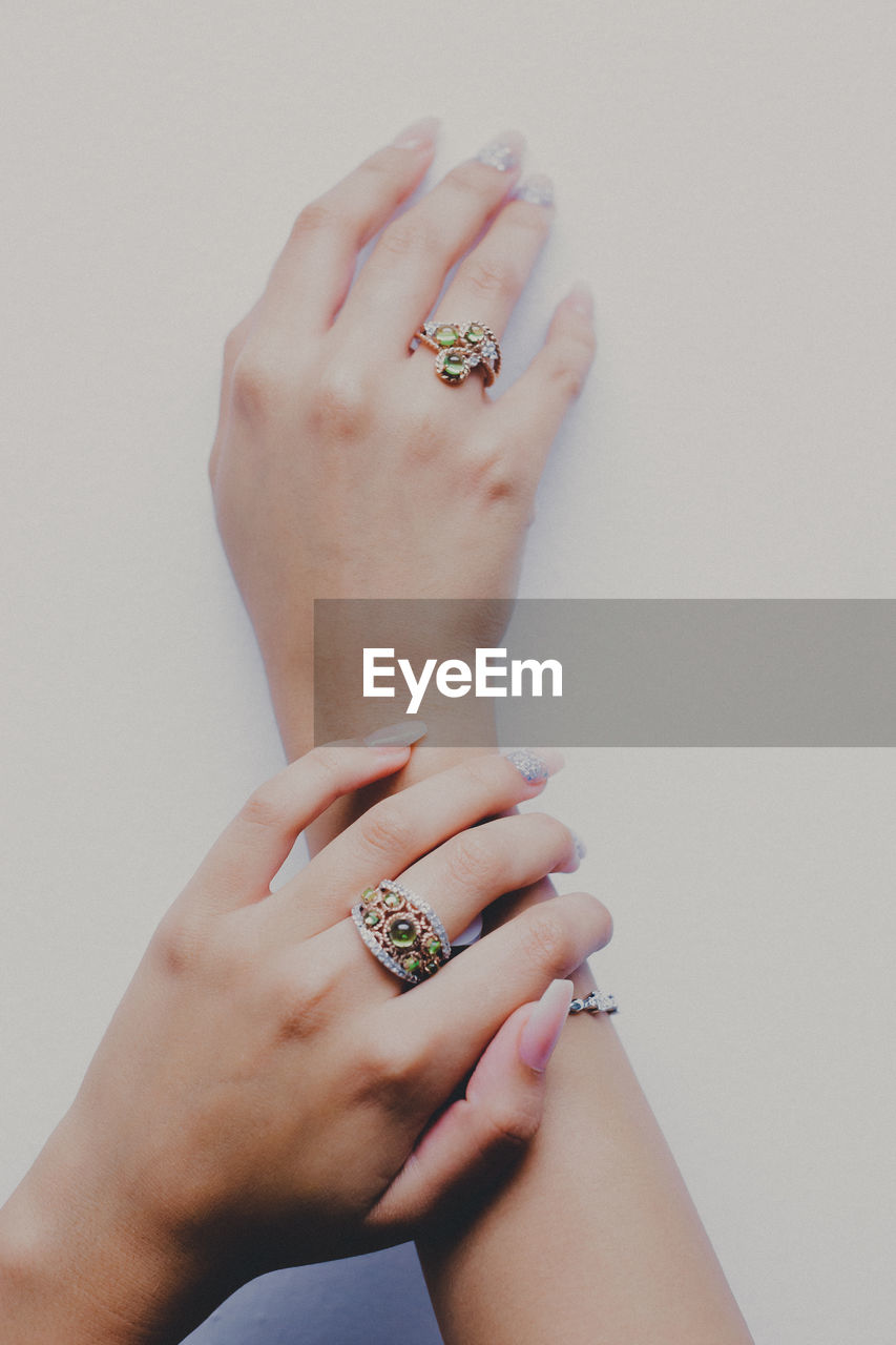 Cropped hands of woman wearing rings
