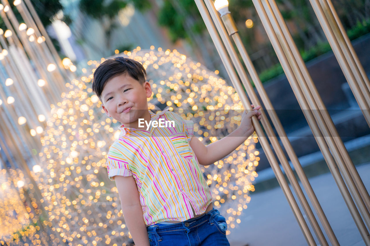 Portrait of boy standing outdoors