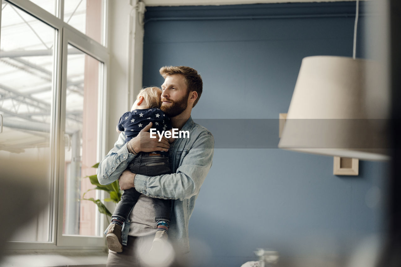 Father spending time with his son at home