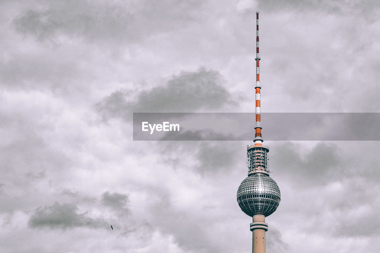 Berlin television tower against cloudy sky