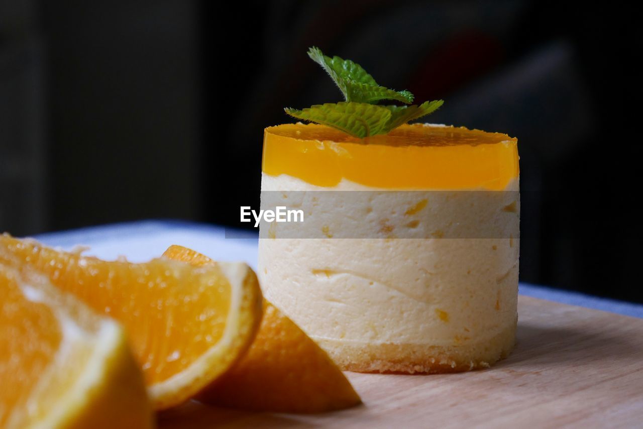 Close-up of orange mousse jelly cake on table