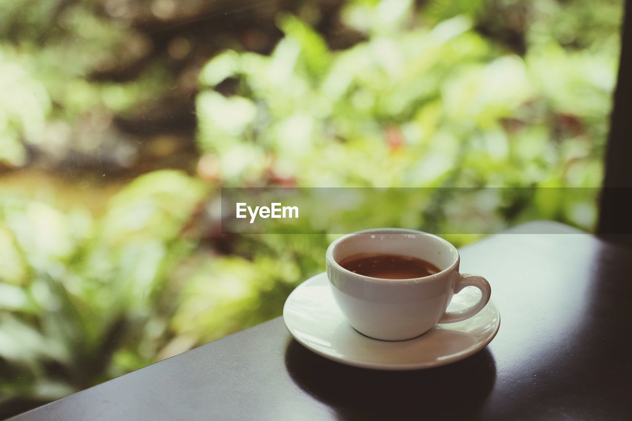 Close-up of coffee cup on table