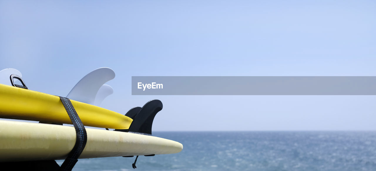 airplane, vehicle, aircraft, sea, water, sky, blue, copy space, nature, aviation, horizon, transportation, horizon over water, no people, clear sky, day, propeller, mode of transportation, outdoors, travel, sunny, aircraft engine