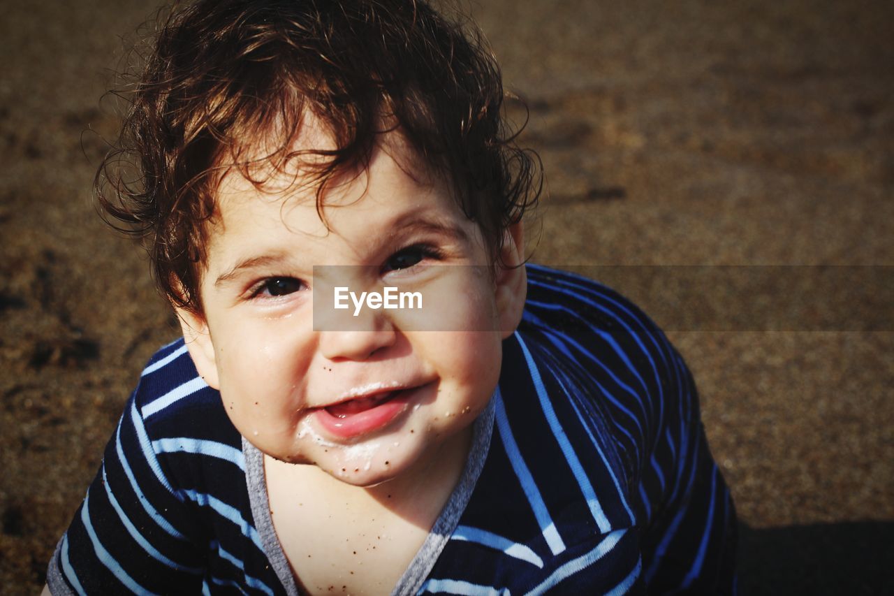 Portrait of cute baby boy at beach