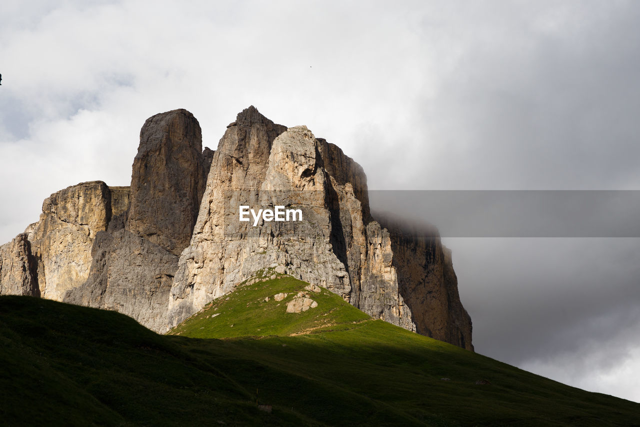 Low angle view of rocks against sky