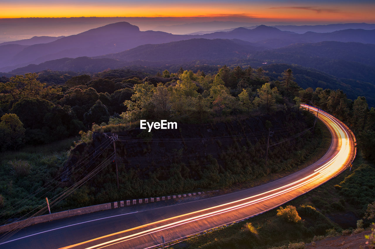 High angle view of light trails on road in city