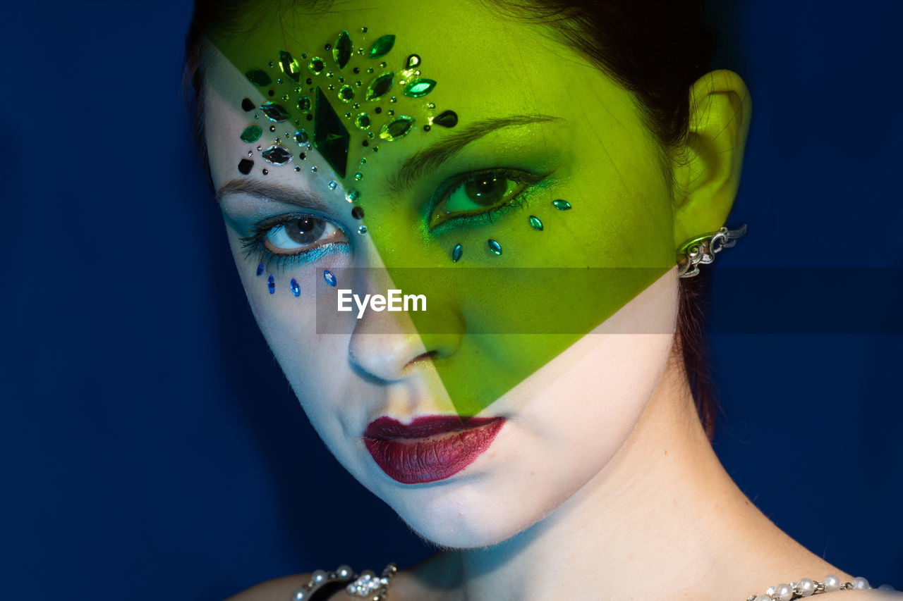 Close-up portrait of young woman with make-up