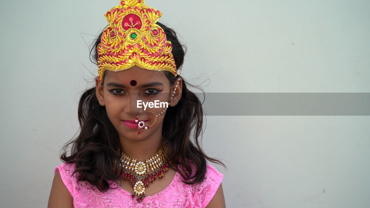 Portrait of beautiful indian brunette girl faces with traditional dress like goddess