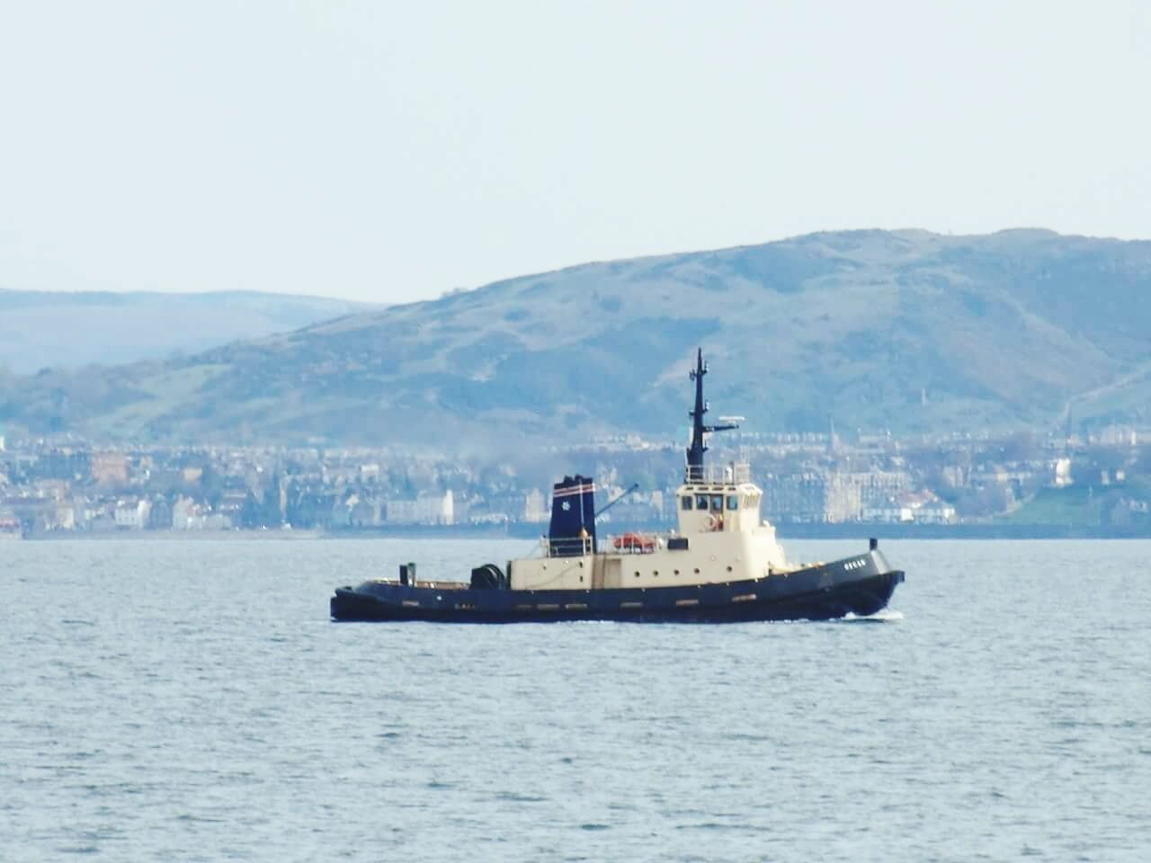 SCENIC VIEW OF SEA WITH BOATS IN BACKGROUND