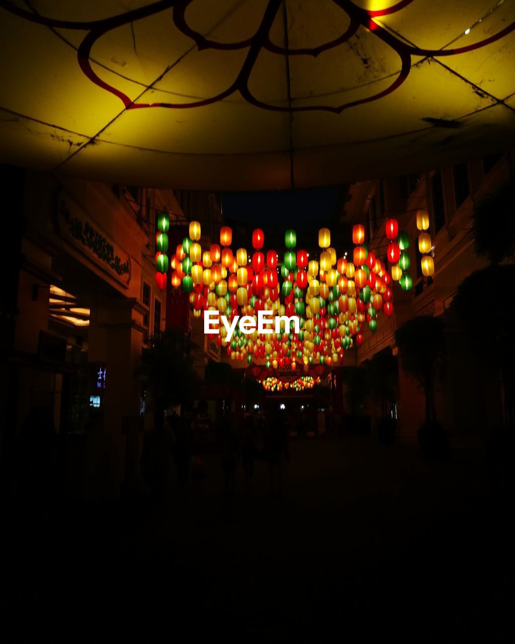 ILLUMINATED LANTERNS AT NIGHT