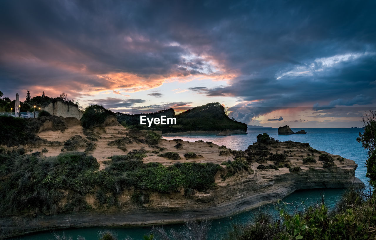 Scenic view of sea against sky during sunset. evening on corfu island.