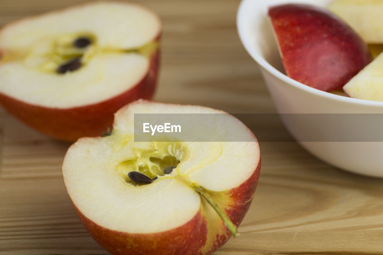 Close-up of halved apple on table