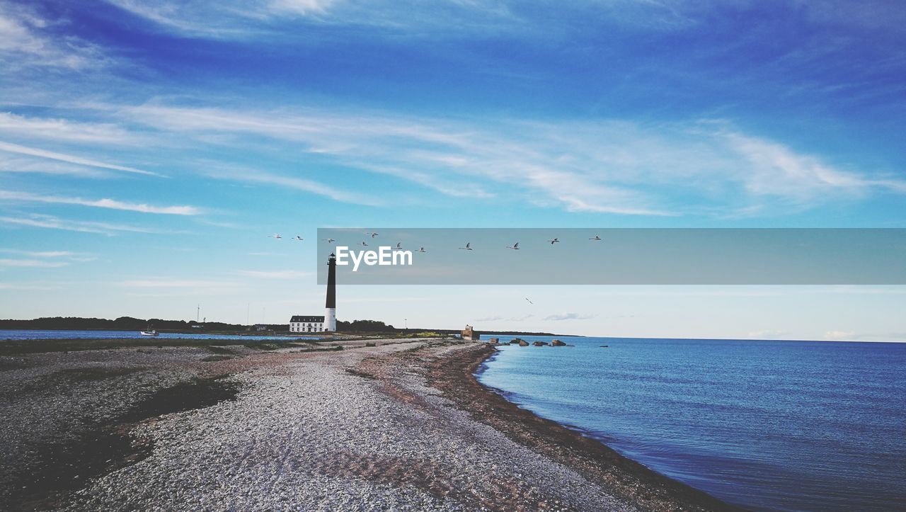 Scenic view of sea against blue sky