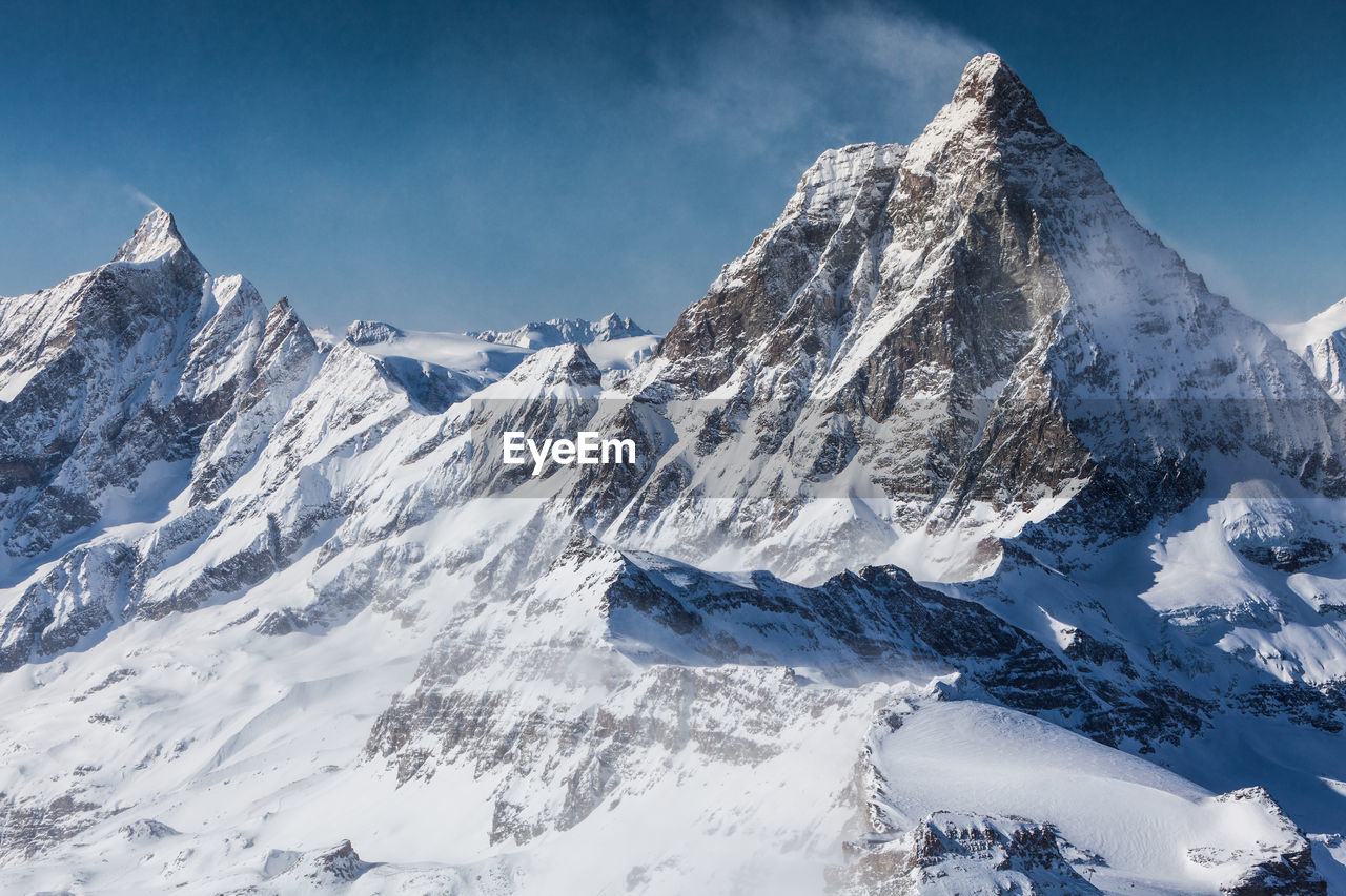 Scenic view of snowcapped mountains against sky. view from klein matterhorn, swiss alps