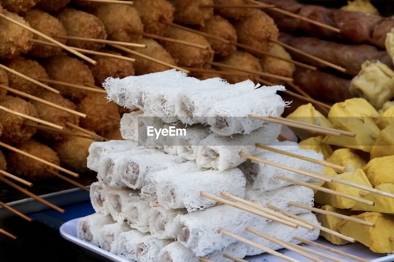 Close-up of skewed food for sale at market