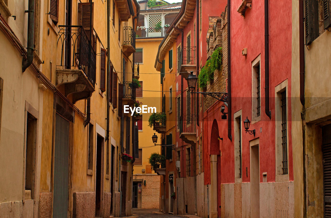 Alley amidst buildings in city