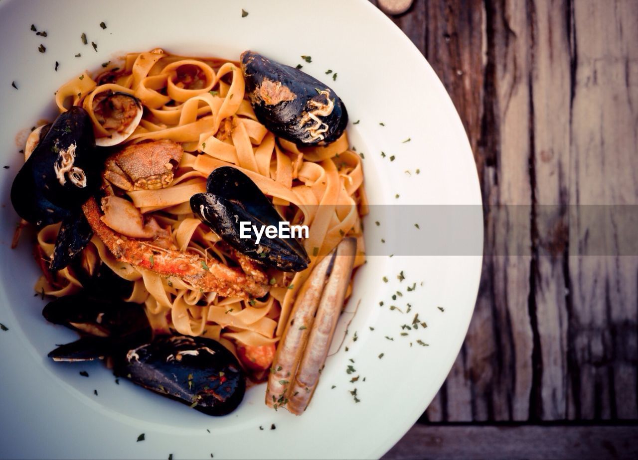 Pasta with mussels on plate