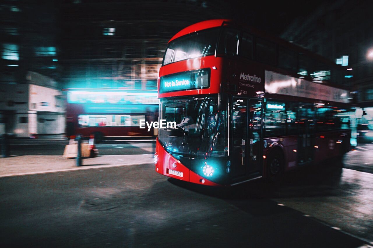Bus on road at night