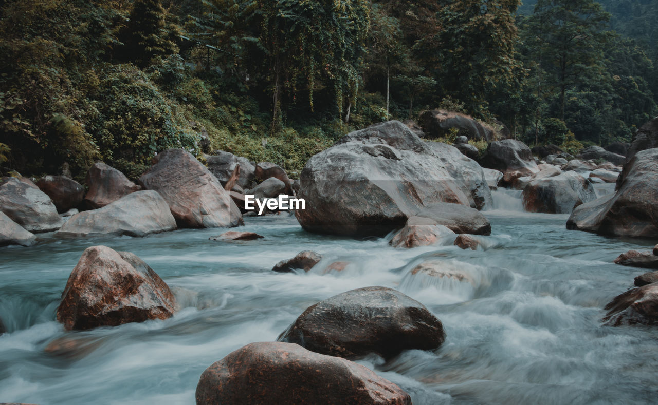 ROCKS BY RIVER