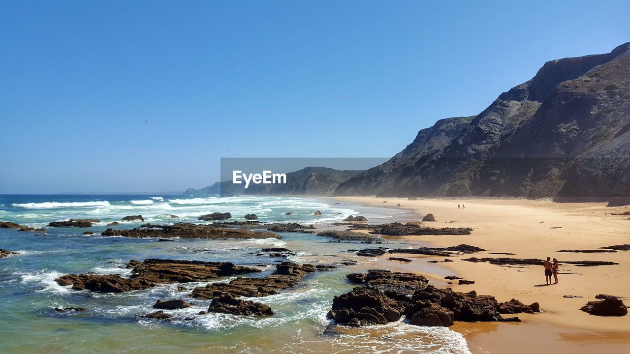 PANORAMIC VIEW OF SEA AGAINST CLEAR BLUE SKY